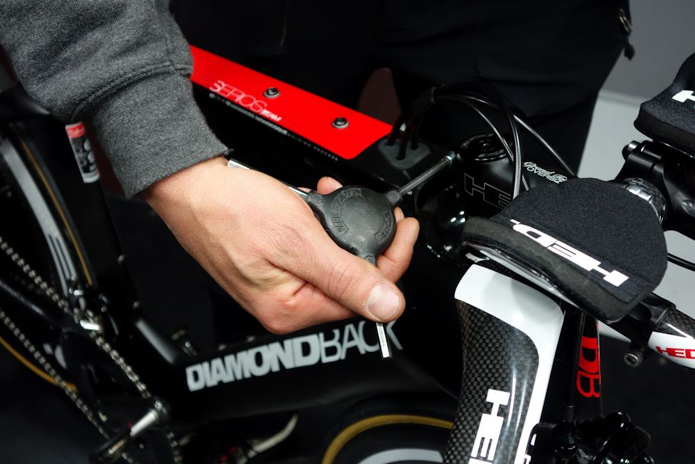 Rick Barrow adjusts the stem height on Colin Joyce&rsquo;s Diamondback Serios.