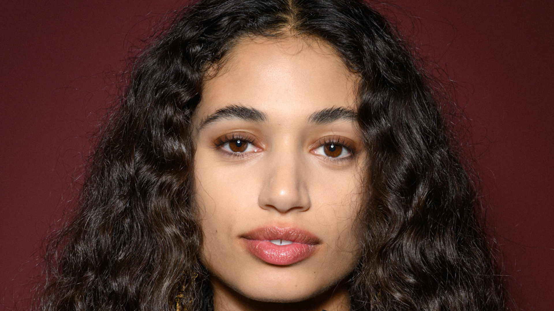 A model wearing a rosy lip color.