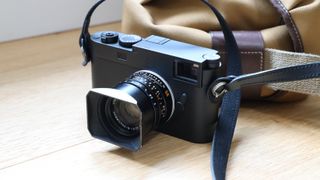 Leica M11 Monochrom digital camera on a wooden surface