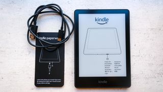 The Kindle Paperwhite 2021 with cord and manual