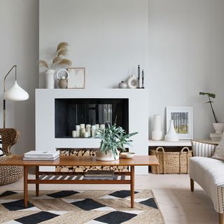 living room with white wall and wooden table