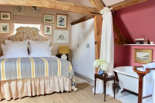 Vanrenen GW Designs attic bedroom with beams and hidden bathroom