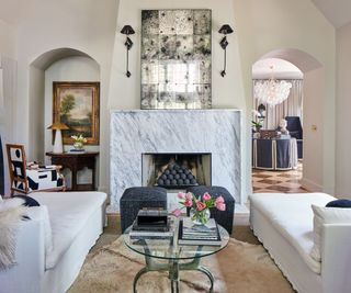 living room with cream walls and black details and textiles