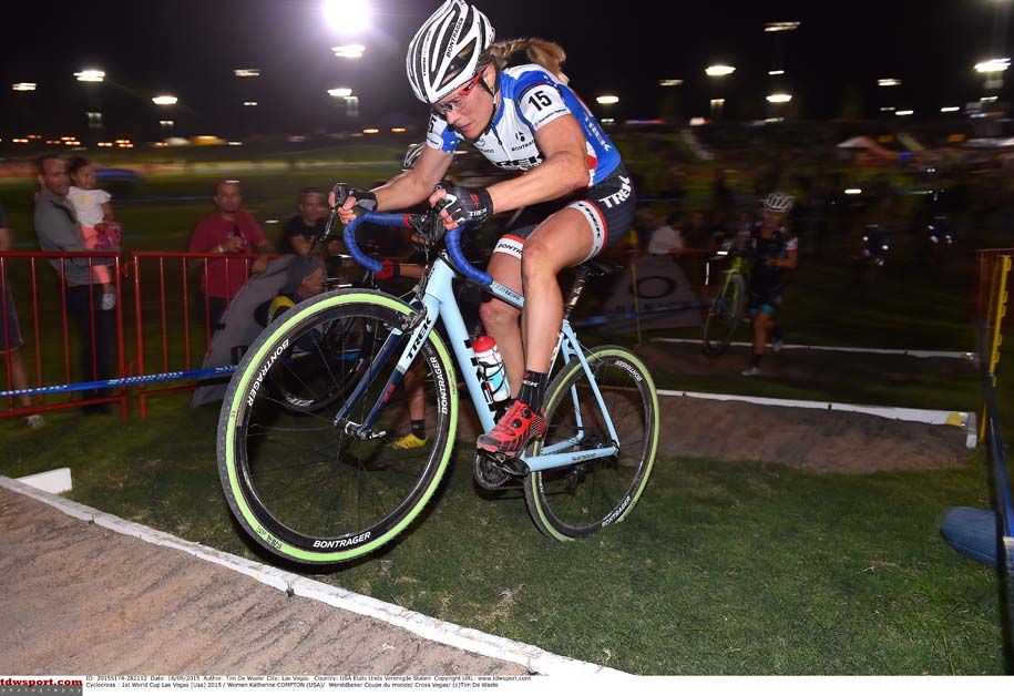 Katie Compton tackles the sand as her chaser is forced off her bike