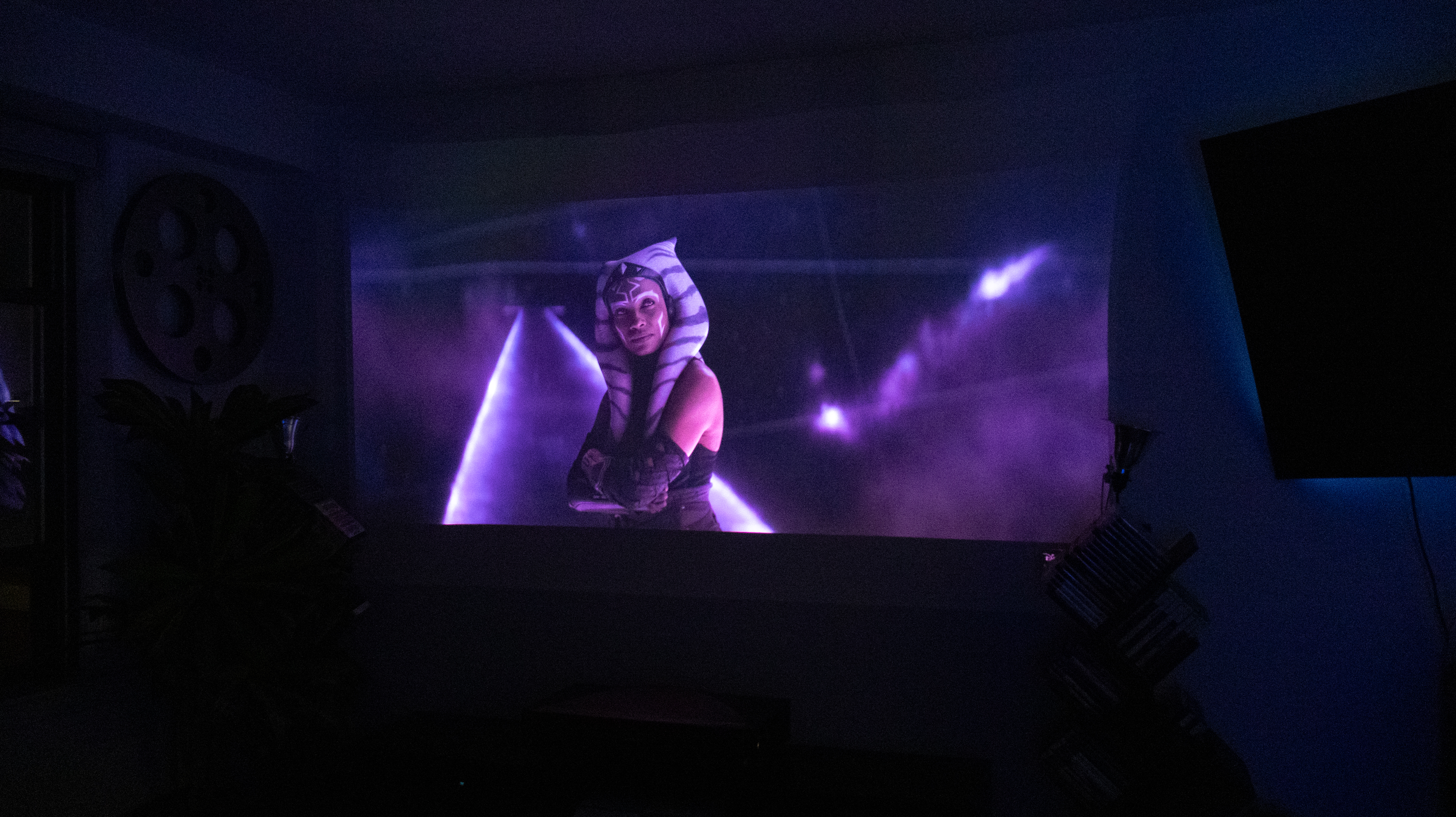 The Hisense L9Q UST projector in a living room