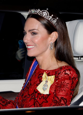 Catherine, Princess of Wales (wearing the Lotus Flower Tiara) departs after attending the annual Reception for Members of the Diplomatic Corps at Buckingham Palace on December 6, 2022 in London, England