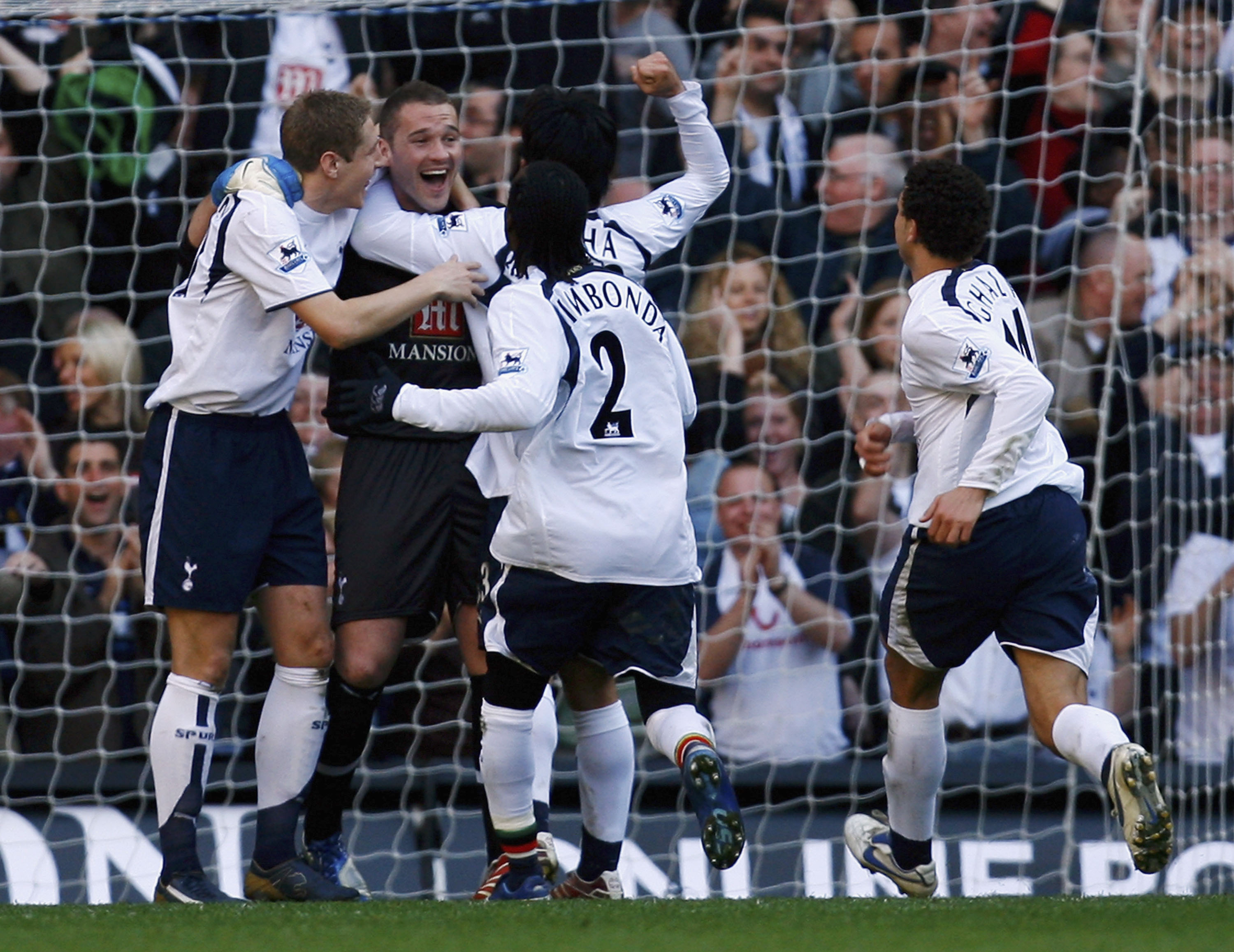 Tottenham goalkeeper Paul Robinson celebrates with his team-mates after scoring against Watford in March 2007.