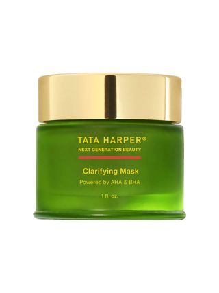 A face mask packaged in a green glass jar with a golden lead features writing which reads 