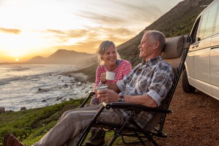 Retired couple have coffee 