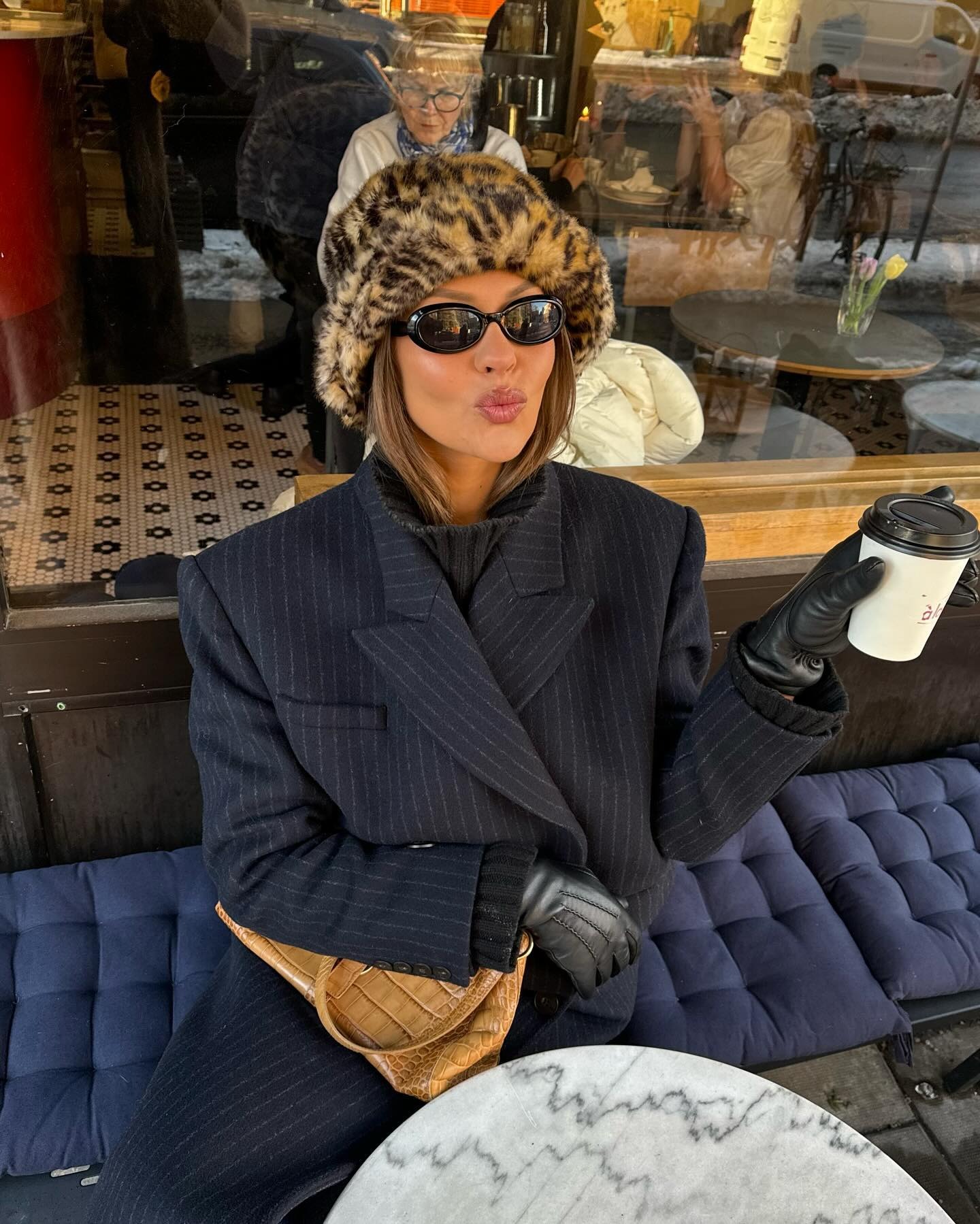 Fashion person Sofia Boman wears a faux fur trend of 2025. She wears a faux fur hat.