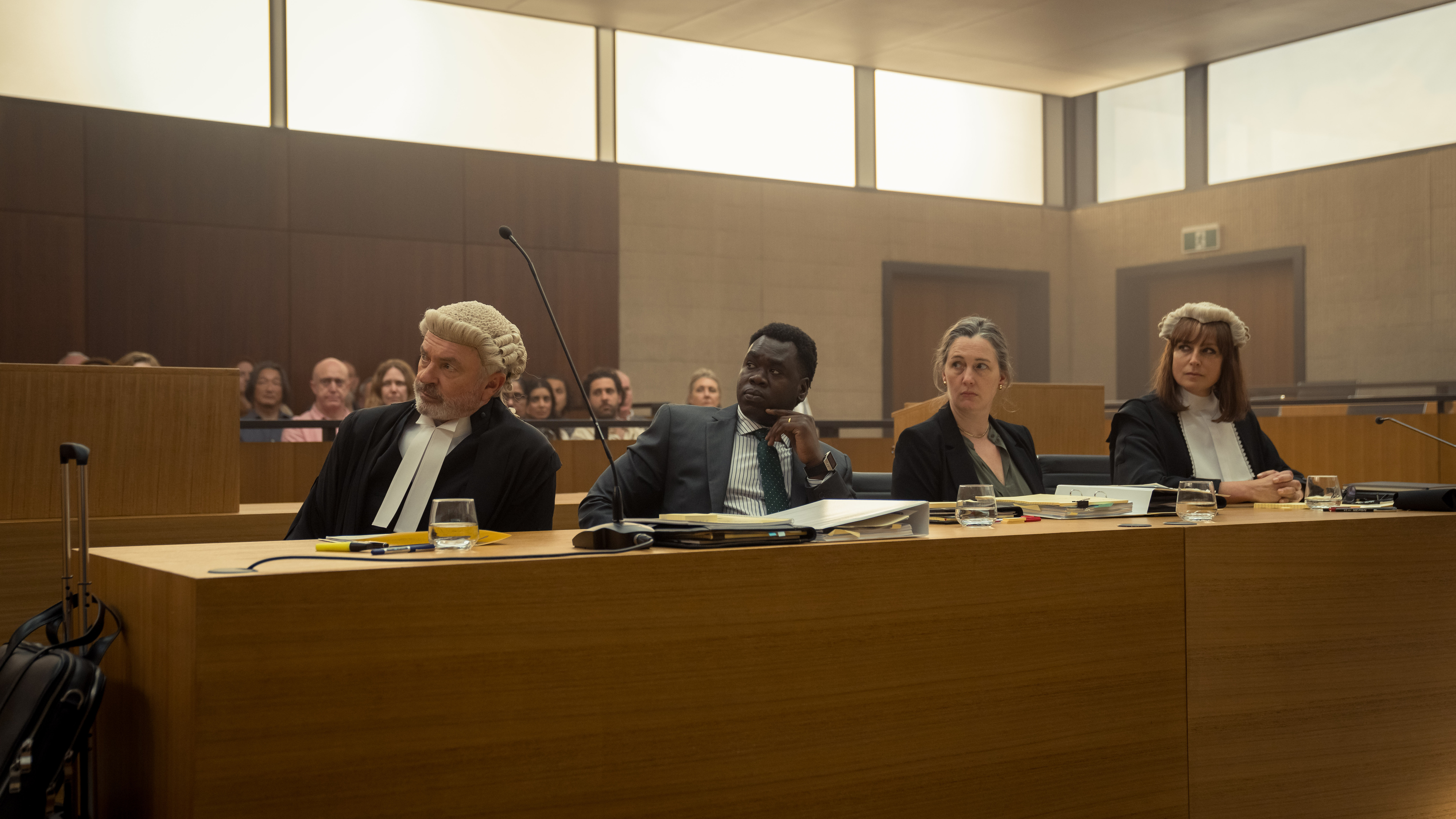 Sam Neill as Colby SC along with other members of the court in The Twelve