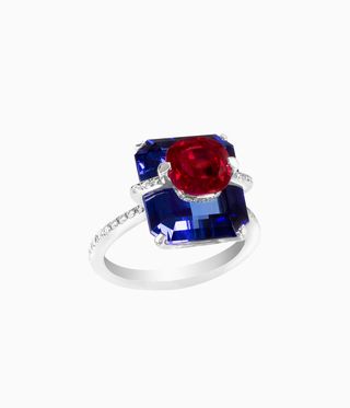 Geneva-based jewellery Ring with silver band, a blue tanzanite stone with a red ruby top.