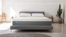 A Simba mattress on a bed in a minimalist room with a rectangle white frame