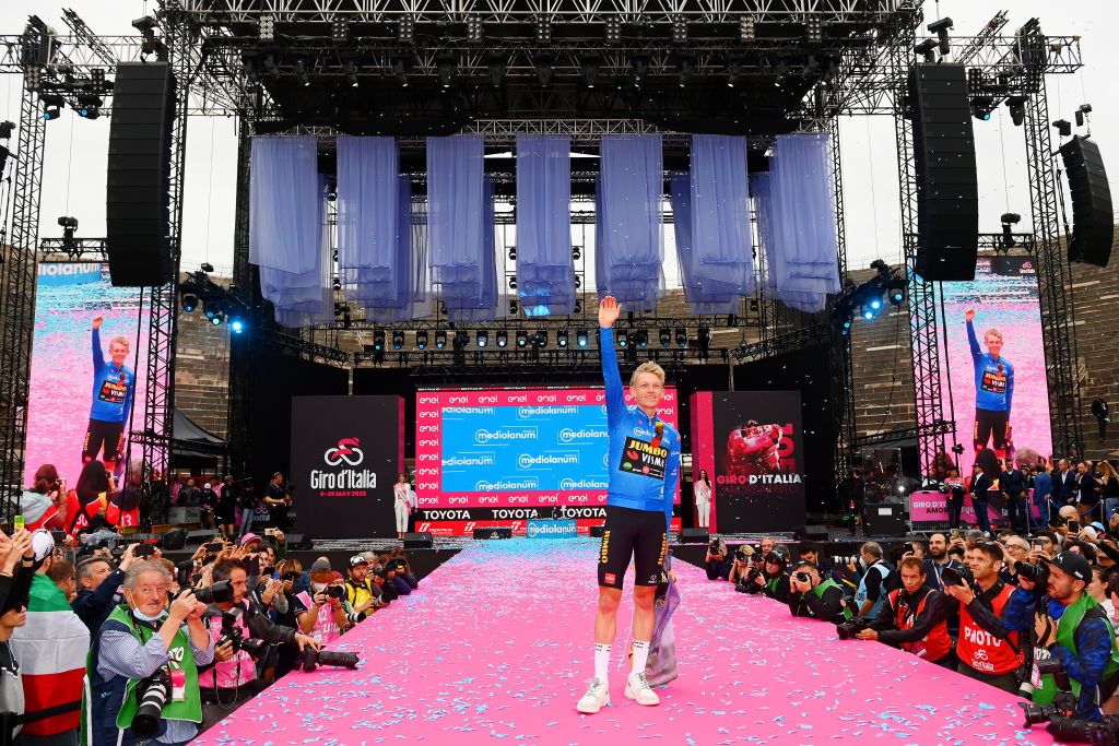 VERONA ITALY MAY 29 Koen Bouwman of Netherlands and Team Jumbo Visma Team Blue Mountain Jersey celebrates at final podium during the 105th Giro dItalia 2022 Stage 21 a 174km individual time trial stage from Verona to Verona ITT Giro WorldTour on May 29 2022 in Verona Italy Photo by Tim de WaeleGetty Images