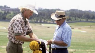 Greg Norman (L) with Butch Harmon during Saturday play at Shinnecock Hills. Southampton, NY 6/17/1995