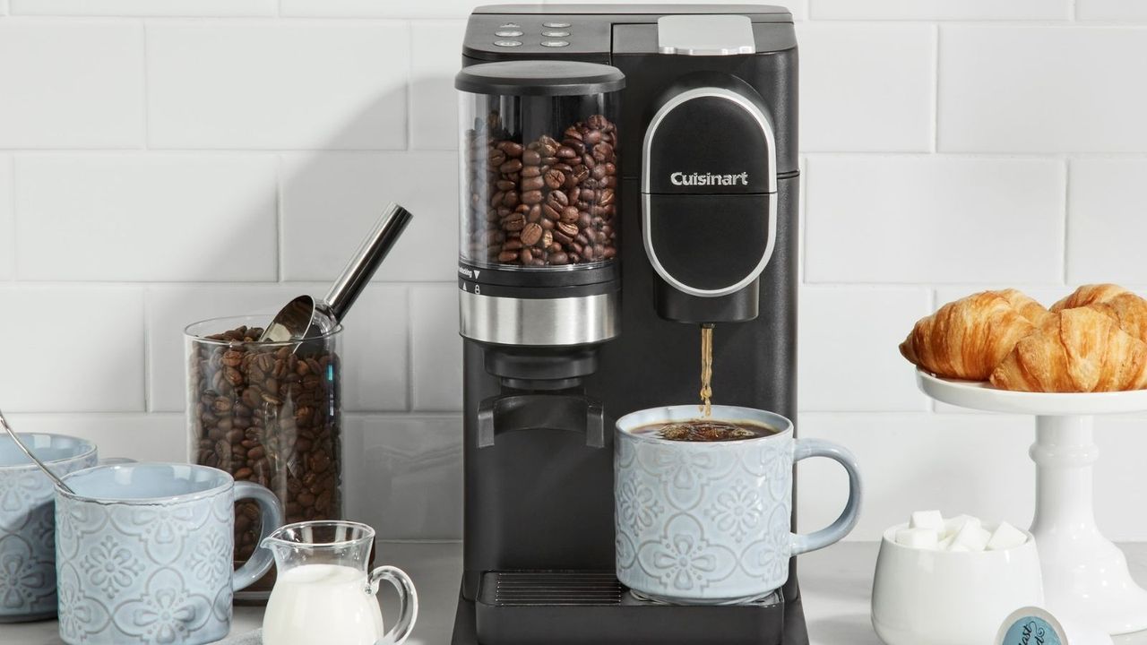 Cuisinart Grind and Brew Coffee Maker on a countertop with croissants and coffee around it