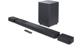 The JBL Bar 1300X soundbar with its detachable rear speakers and a large subwoofer box