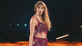 Taylor Swift in pink 1989 eras tour outfit in Eras Tour movie