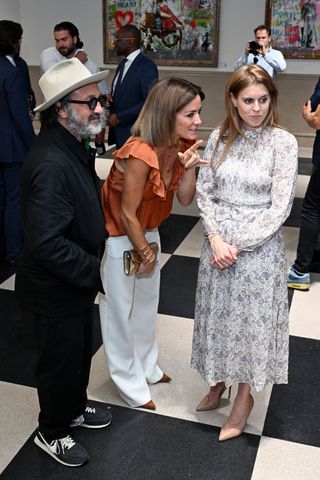 Princess Beatrice wearing a long floral dress to Mr. Brainwash by Clarendon Fine Art and Jack Barclay Bentley in London July 2024