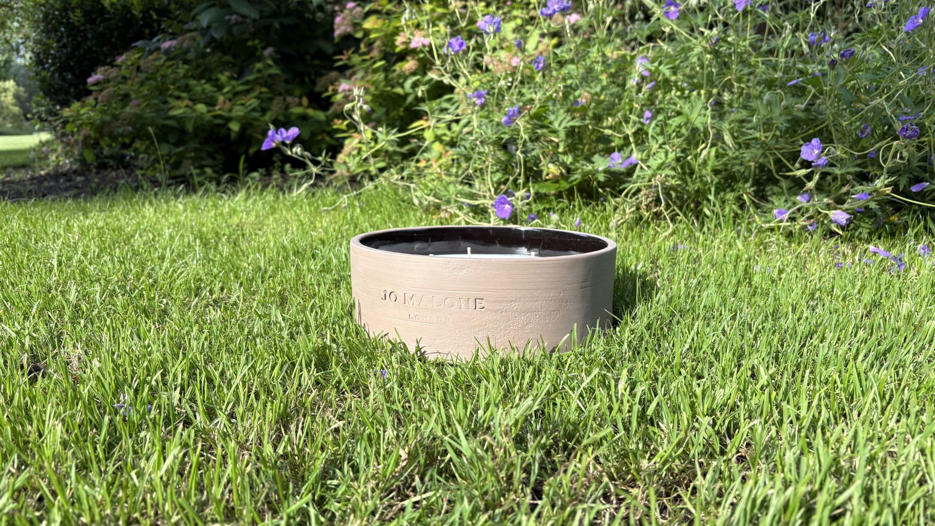 Jo Malone Outdoor Candle on grass outside