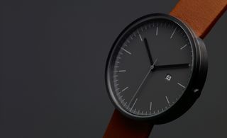 Black watch face with brown leather strap
