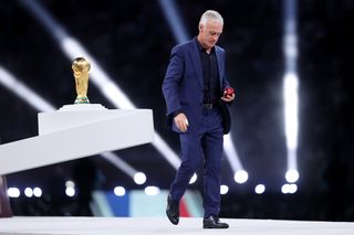 France coach Didier Deschamps collects his runner-up medal after the World Cup 2022 final loss to Argentina in Qatar.