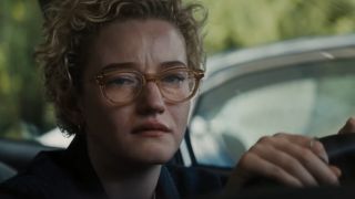 Julia Garner, playing schoolteacher Justine Gandy in Weapons, cries in her car.