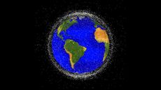 The space junk appears as many small white points surrounding Earth, which has bright blue oceans and green and brown continents. The space junk is thick enough to form a cloud that obscures most of the black background when viewed from the edges around Earth.