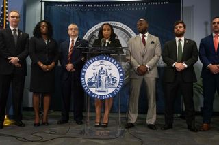 Fulton County District Attorney Fani Willis holds a press conference in the Fulton County Government Center after a grand jury voted to indict former US President Donald Trump and 18 others on August 14, 2023, in Atlanta, Georgia. The Georgia prosecutor who brought sweeping charges against former president Donald Trump and 18 other defendants said Monday, August 14, that she wants to hold their trial "within the next six months." Fulton County District Attorney Fani Willis said arrest warrants had been issued for Trump and the others charged over their efforts to overturn the 2020 election and they had until August 25 to "voluntarily surrender."