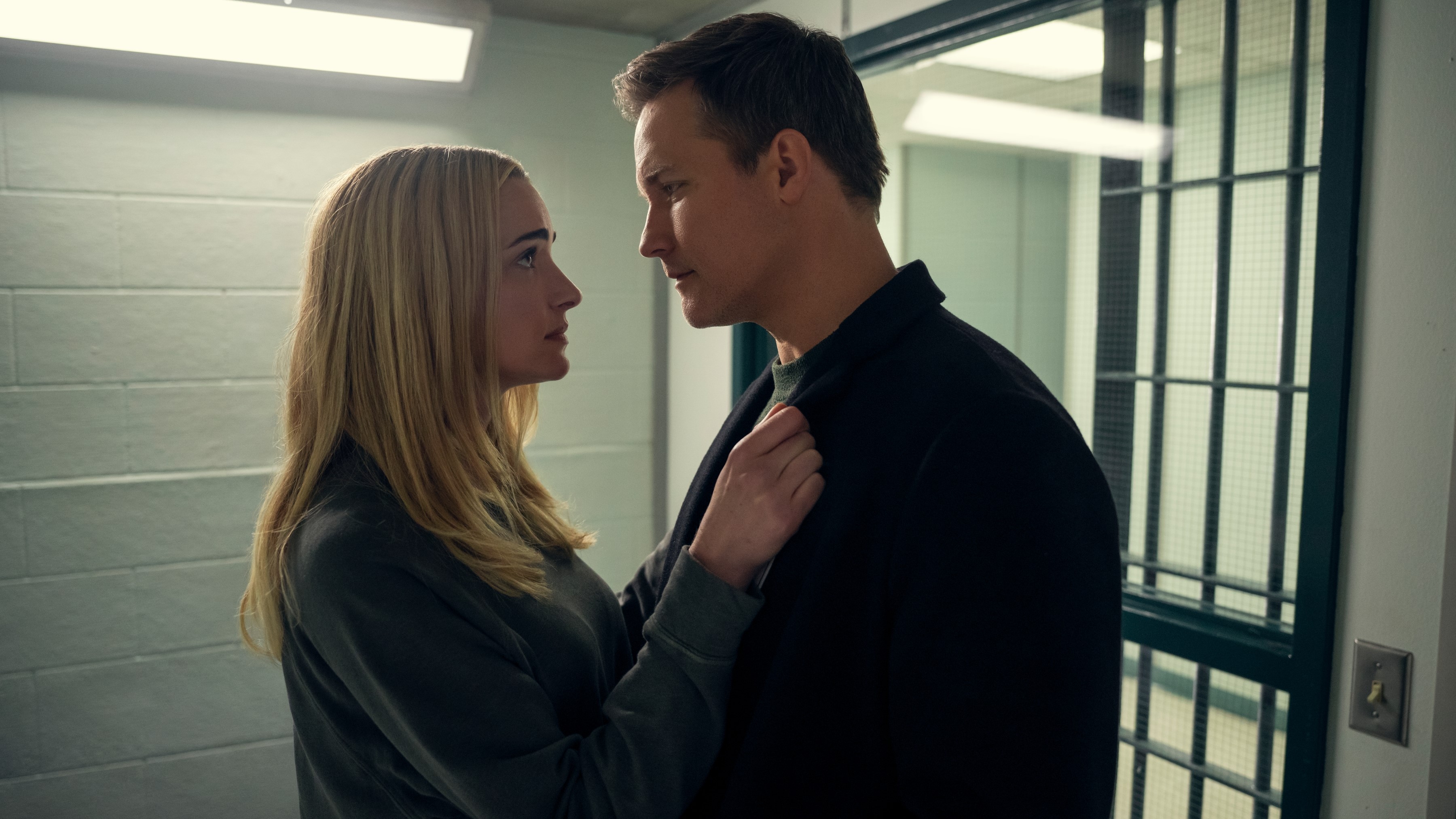 Brianne Howey as Georgia Miller and Scott Porter as Paul in jail in Ginny & Georgia season 3