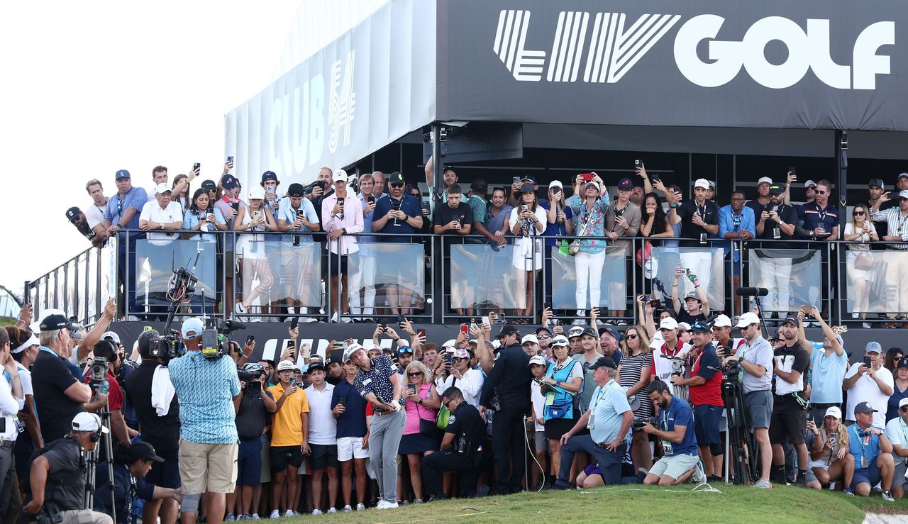 Cameron Smith hits a chip shot in front of LIV Golf fans