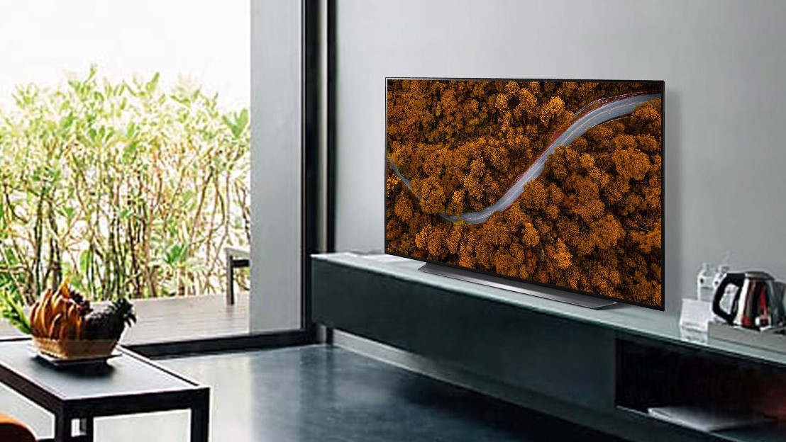 LG CX Series OLED on a TV stand in a modern looking living room