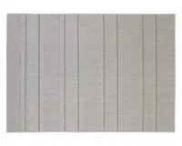 A neutral woven outdoor garden rug with a thin stripe