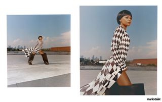 Actress Myha'la Herrold standing on a roof with New York City in the background in a black and white checkered dress and oversized black boots