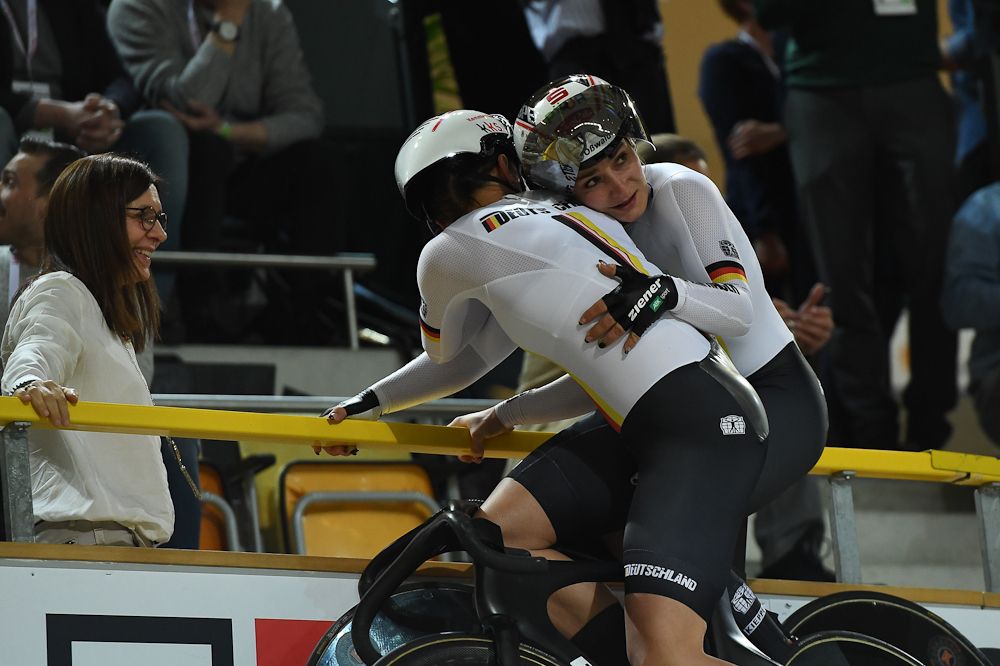 Germany's Miriam Welte (L) and Kristina Vogel celebrate after their victory in the women's team sprint final race at The UCI World Cycling Championships