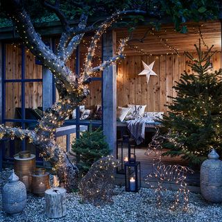 Outdoor Christmas lighting ideas with trees and fairy lights