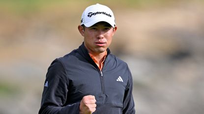 Collin Morikawa fist pumps after winning the AT&T Pebble Beach Pro-Am