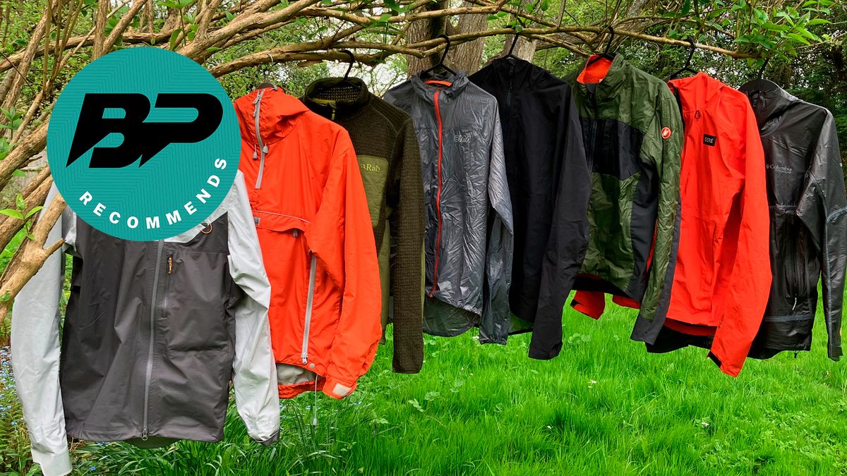 A number of cycling jackets hanging from a branch