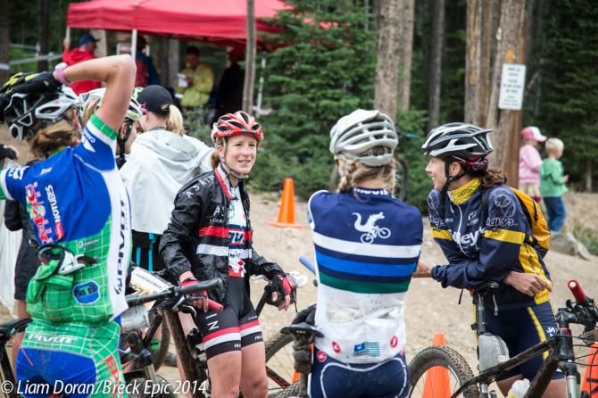 The top women exchange war stories at the end of the stage.