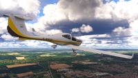 A screenshot from Microsoft Flight Simulator 2024 of a white plane with a yellow stripe flying over the UK.