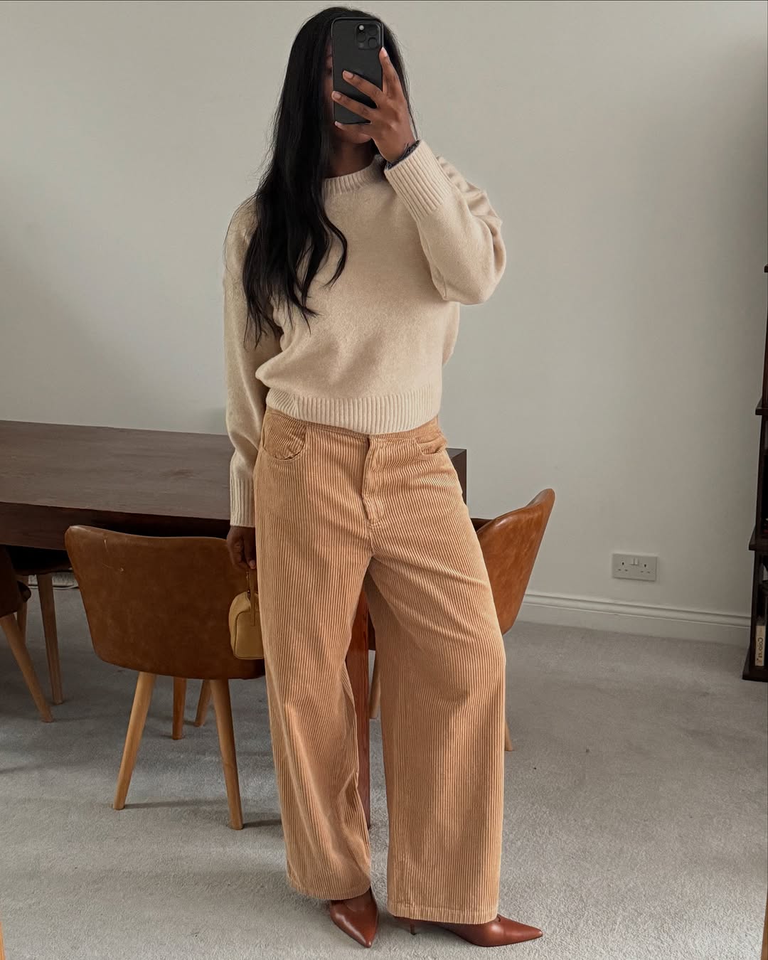 woman wearing winter to spring transitional pant trend 2026