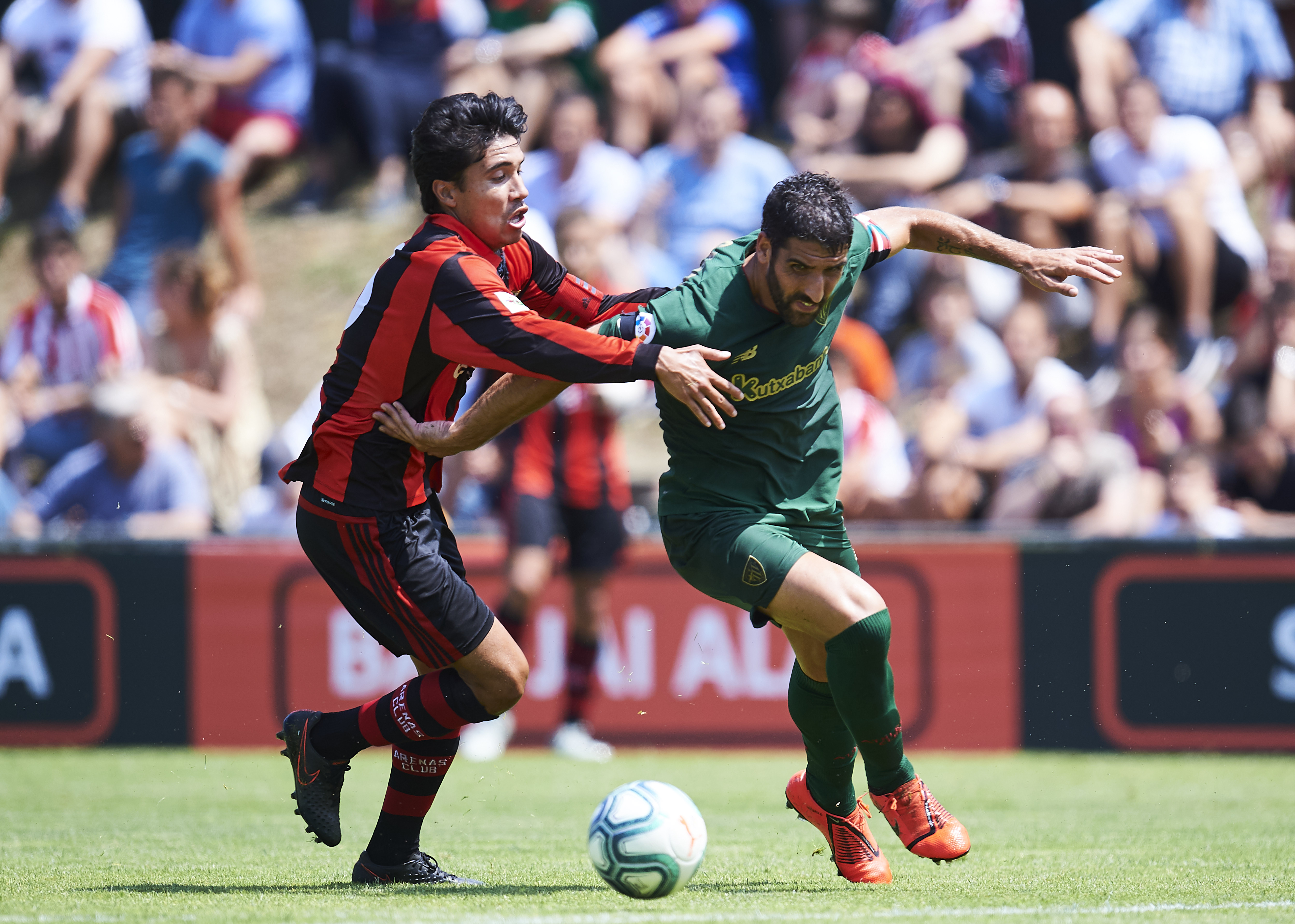 Ina Uranga of Arenas competes with Athletic Club's Raul Garcia in a friendly in July 2019.