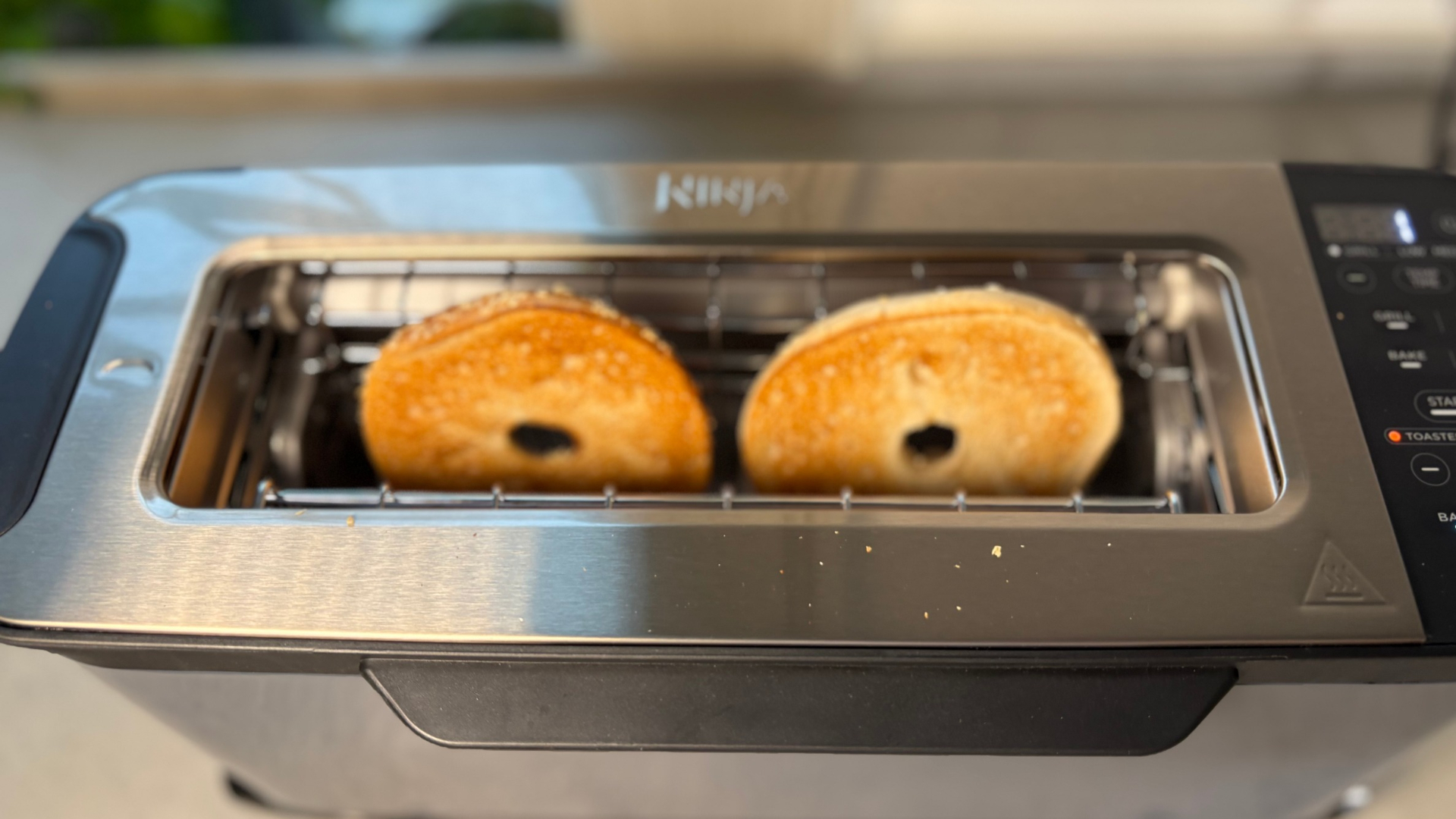 Testing the Ninja Foodi 3-in-1 Toaster Grill Panini Press on the counter toasting bagels