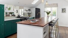 A ground floor extension gave Julie and James the chance to create their dream kitchen, with a vaulted ceiling and bold but sophisticated Shaker-style units