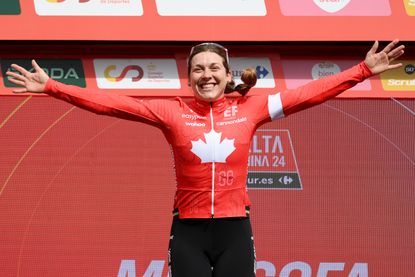 Alison Jackson celebrates on the podium after winning stage two of the Vuelta Femenina 2024