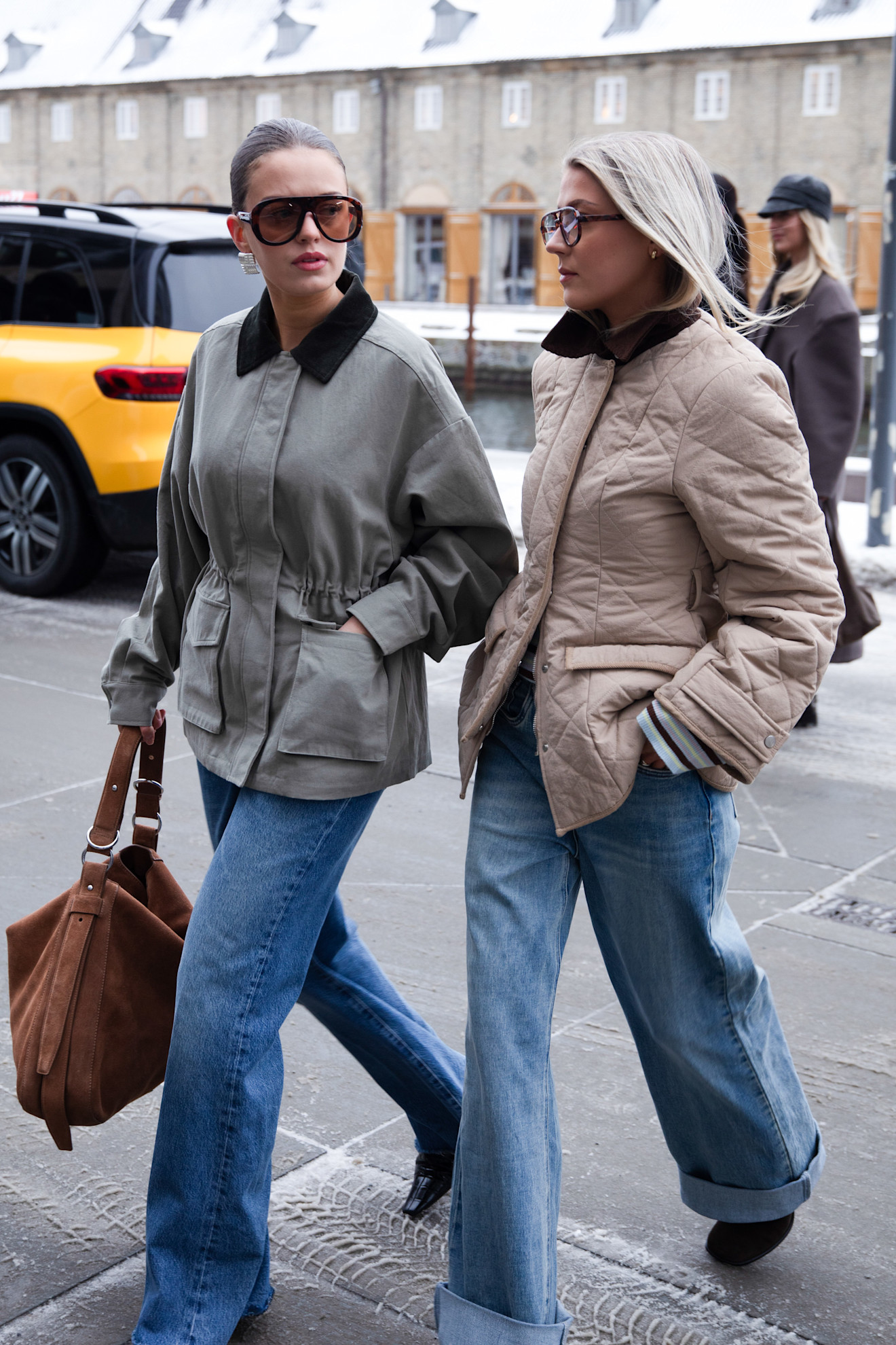 women wearing jeans and work jackets in Copenhagen