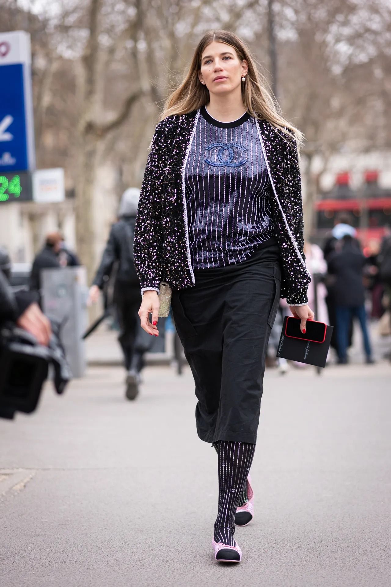 a woman wears cap-toe ballet flats in Paris