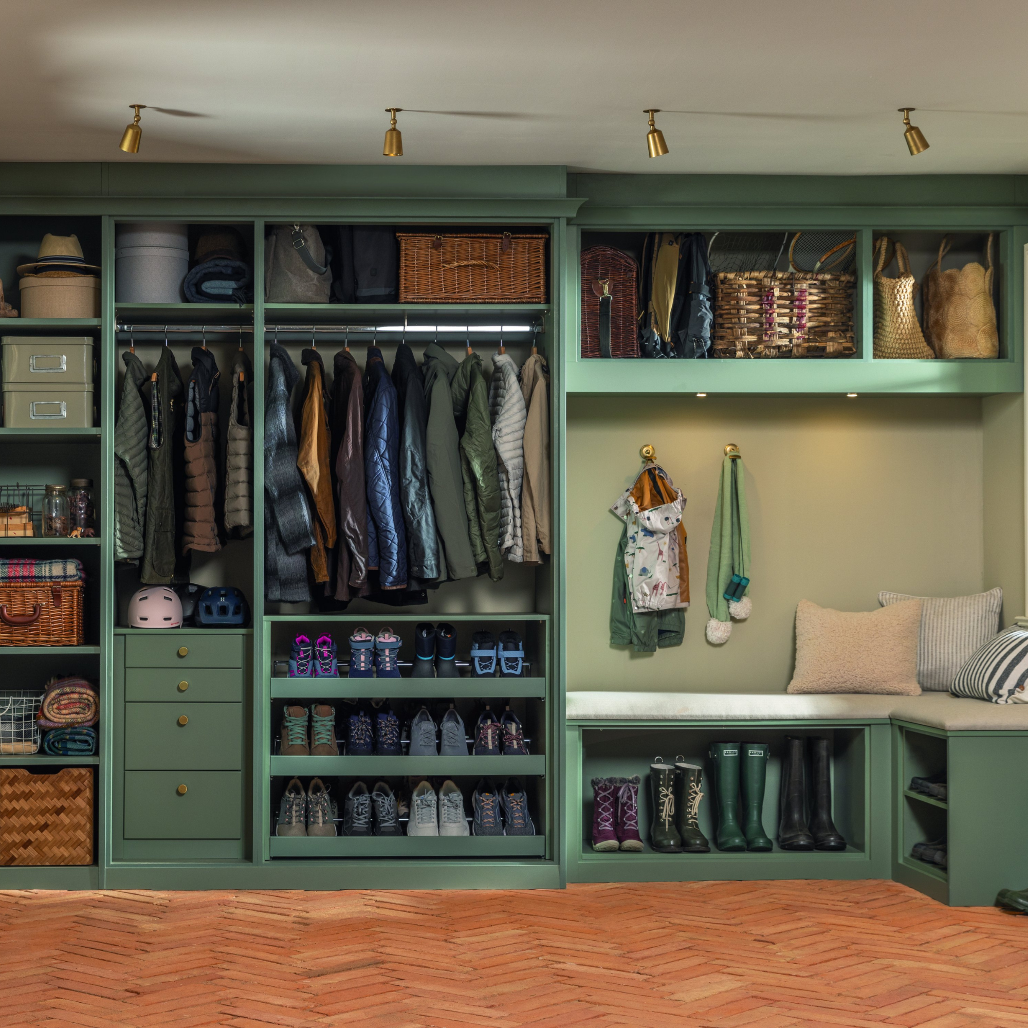 Boot room with built in green storage for coats, shows and drawers