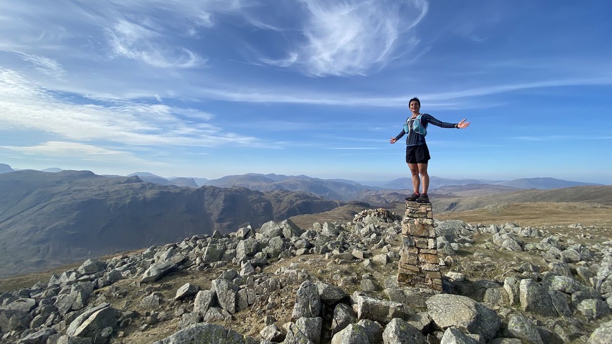 Sabrina Verjee stands on a trig