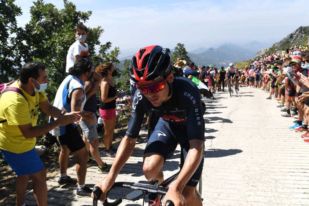 PICO VILLUERCAS SPAIN AUGUST 28 A general view of Thomas Pidcock of United Kingdom and Team INEOS Grenadiers beginning to climb the Alto Collado de Ballesteros 1415m while fans cheer during the 76th Tour of Spain 2021 Stage 14 a 1657km stage from Don Benito to Pico Villuercas 1580m lavuelta LaVuelta21 on August 28 2021 in Pico Villuercas Spain Photo by Tim de WaeleGetty Images